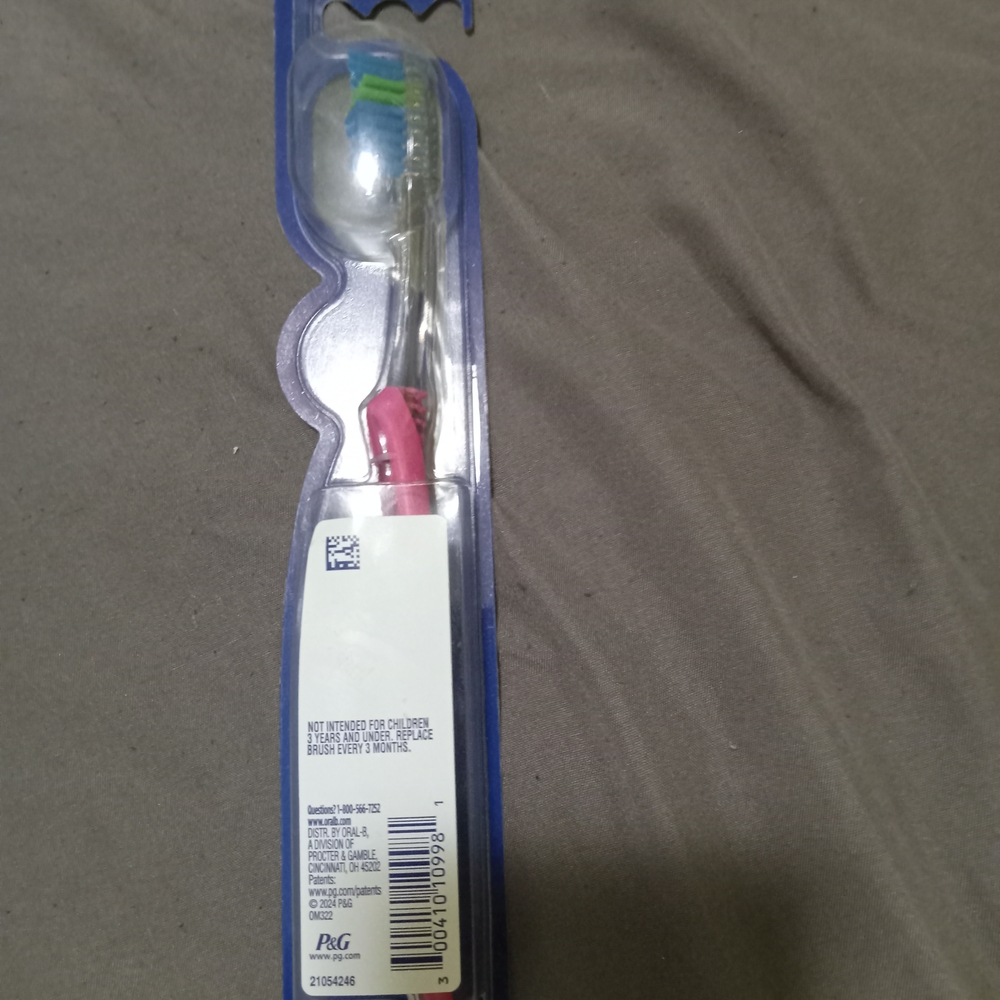 Oral-B Toothbrush with Blue and Green Bristles